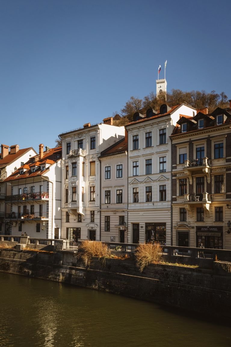 Historic riverside buildings along the Ljubljanica River in Ljubljana, Slovenia.